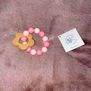 SJC from hobby lobby . Baby teether pink with wood